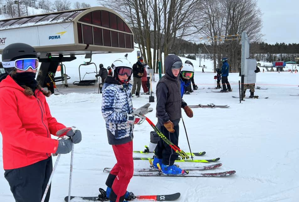 Three children skiing 